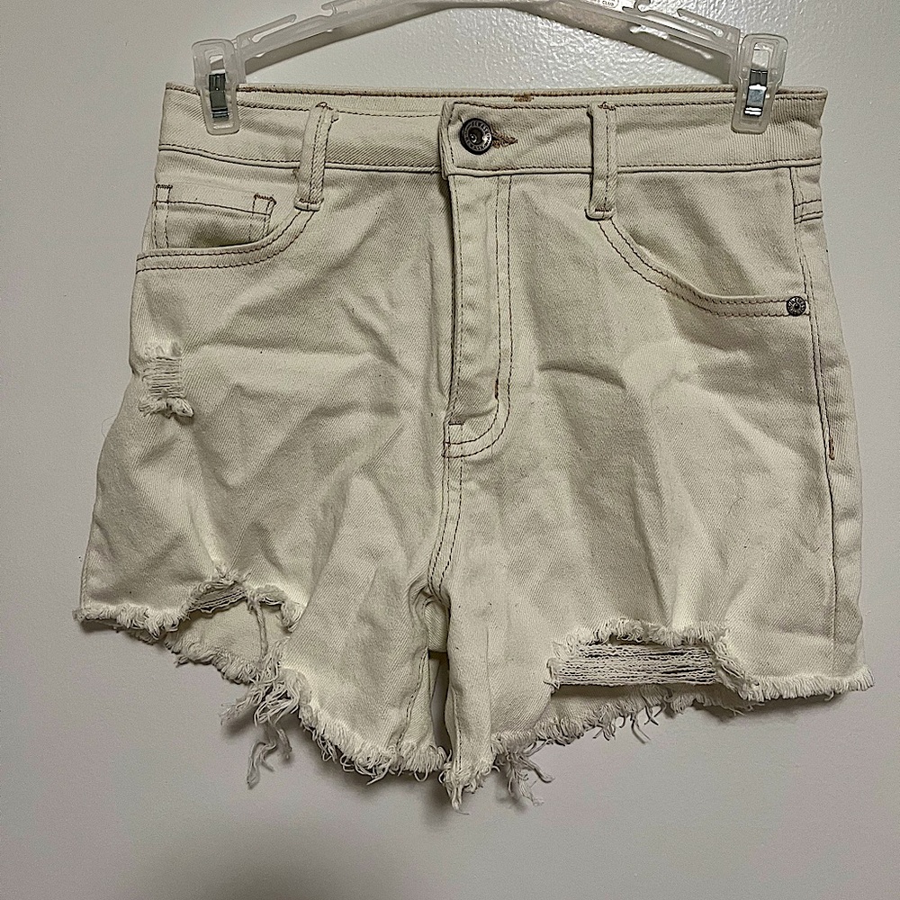 These r high waisted ripped jean shorts with a tan stitching and no stains/rips